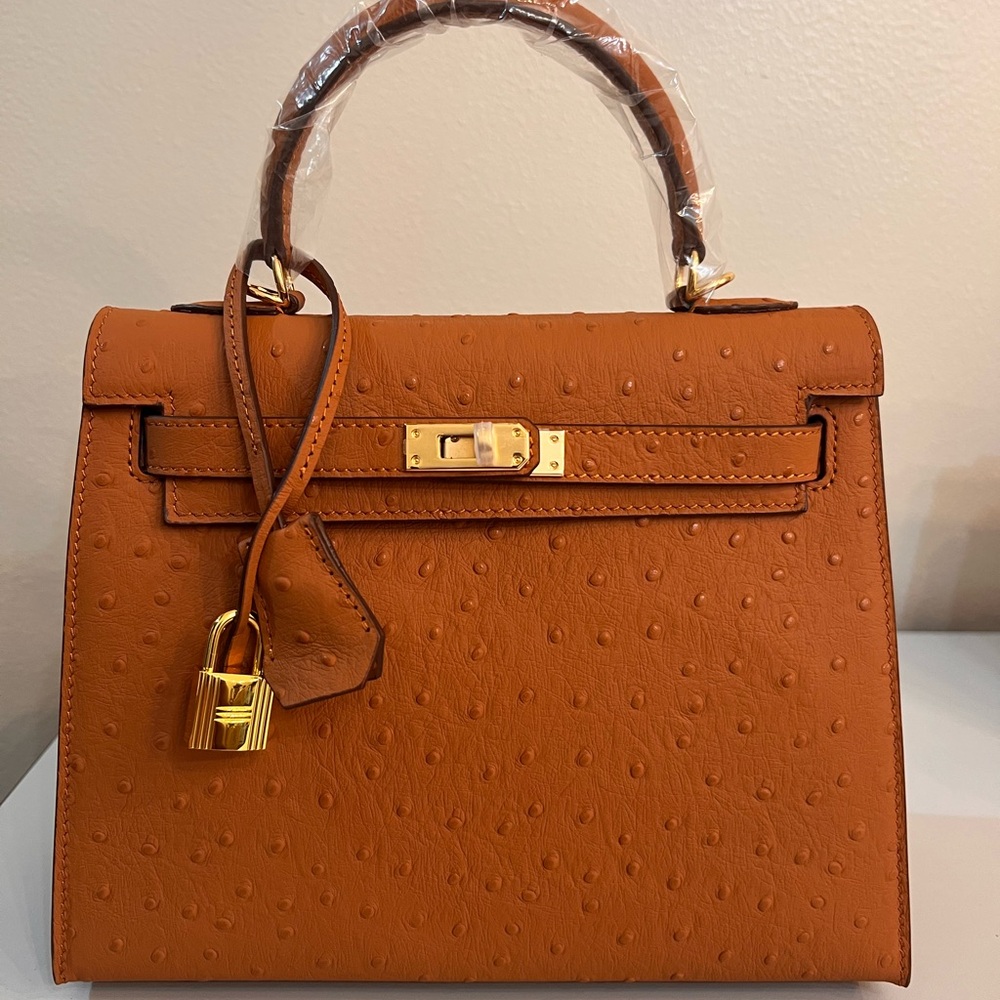 Ostrich embossed Genuine Leather 25cm handbag with Gold Hardware.